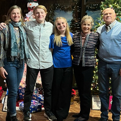 Patricia Long stands with her family.