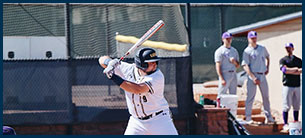 Number 9 student-athlete at bat ready to swing.