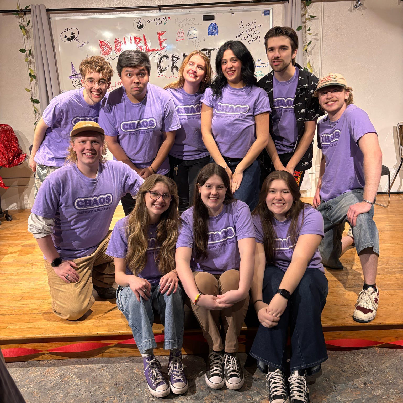 Chaos improv debuts their new members (and t-shirts!) for the 25-26 academic year. From left to right: Ryan Mauck, Markus Rodriguez, Lexi Murphy, Abby Haimoff, Nolan Bond, Henry McBride (top), Nicolas Weary, Abigail Pilgrim, Dee Dee Martin, Jessica Riley (bottom)