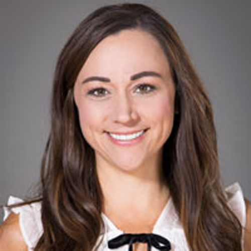 Julie Bell facing front and smiling.