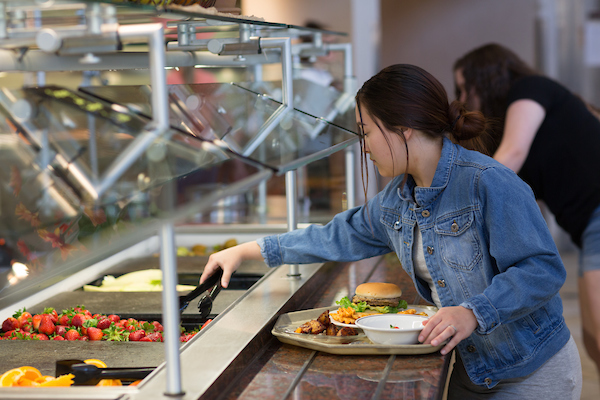 Dining halls feature food stations and salad bar