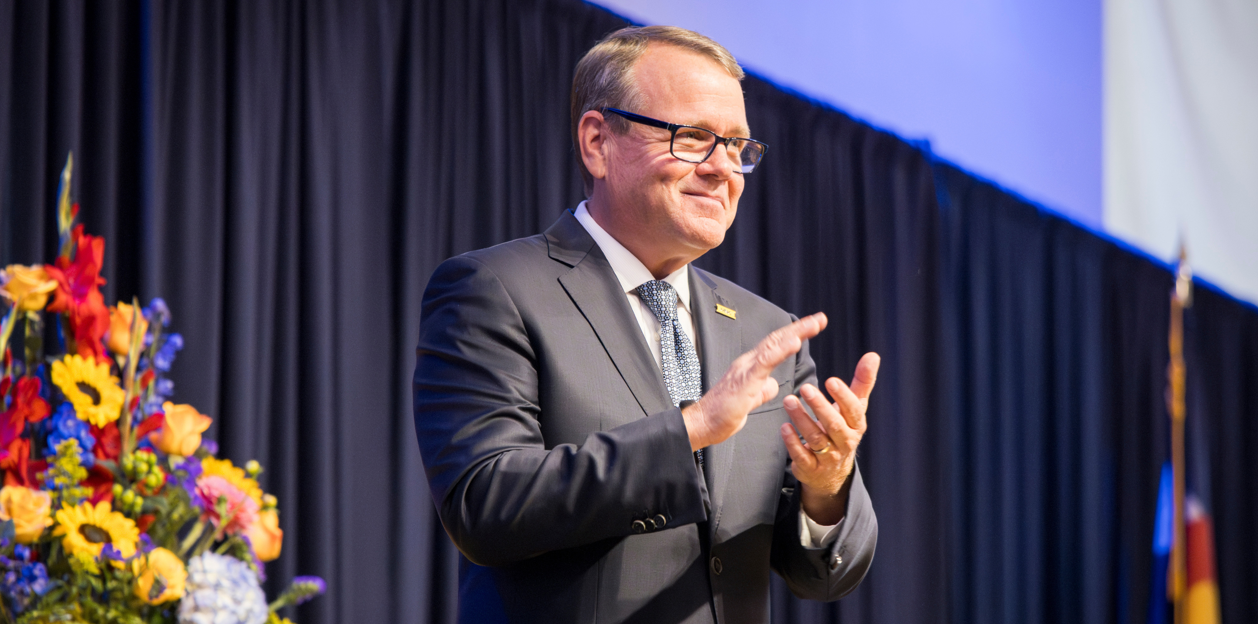 President Feinstein in mid clap and smiling